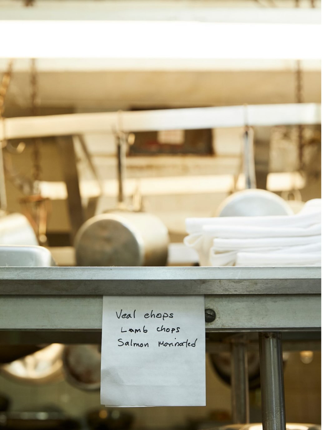 Kitchen pass with handwritten dish note